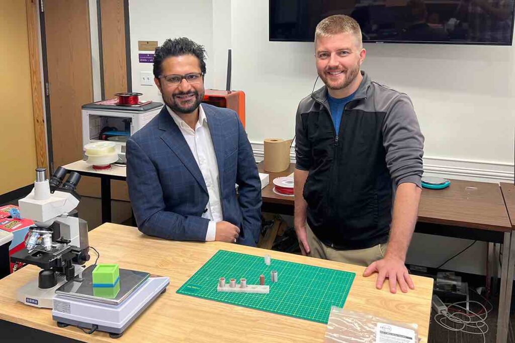 UCF Researchers display the cylindrical 3D printed lunar regolith bricks they created using simulated lunar and Martian regolith