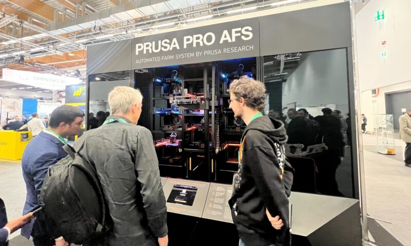 Visitors exploring the Prusa Pro AFS at Formnext 2022